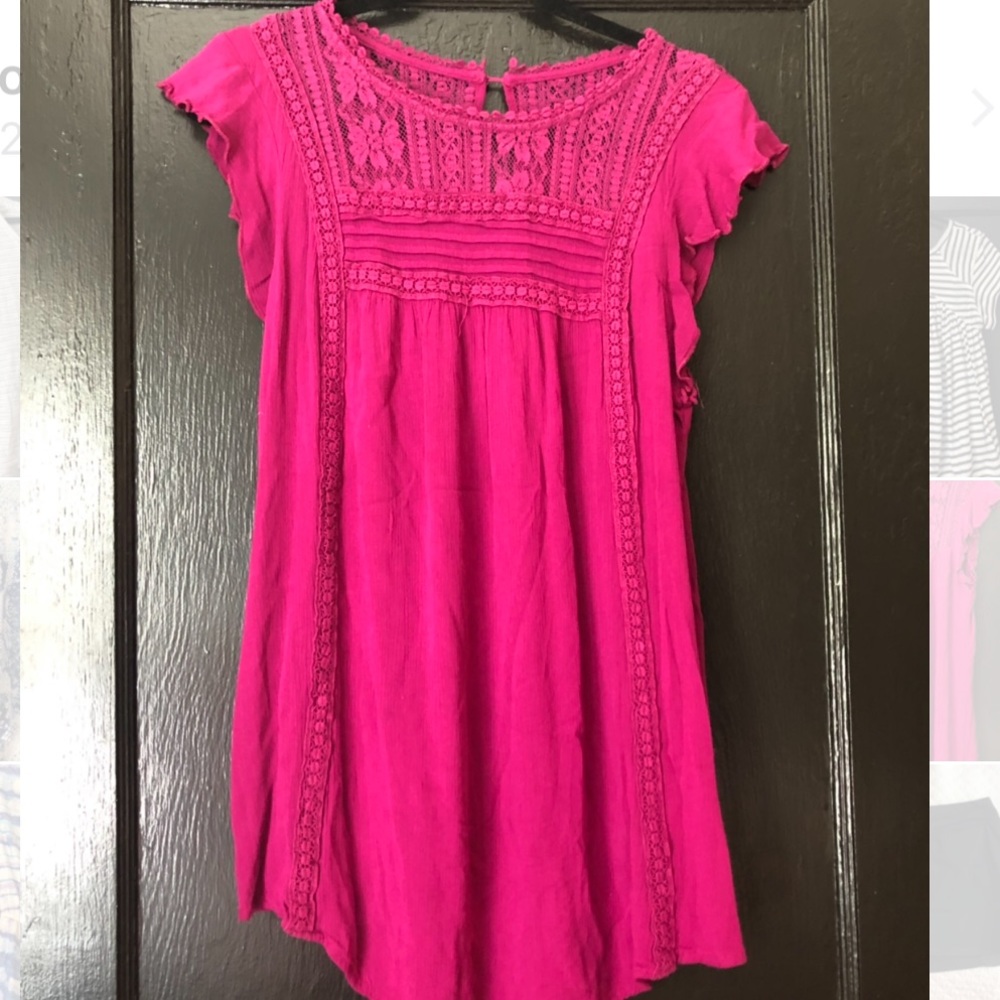 Long pink short sleeve shirt.